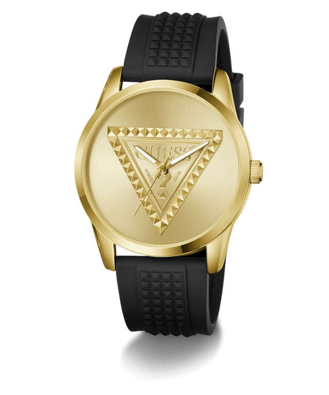 A Guess women's analog watch featuring a gold-tone round case, a gold-tone dial with an embossed triangle logo, and a textured black silicone strap.