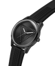 A black analog watch with a textured strap and a geometric pyramid dial design, shown on a clean white background. lifestyle