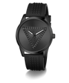 A black Guess wristwatch with a textured triangular logo on the dial and a matching black silicone strap with a pyramid pattern, shown against a plain white background.