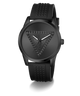 A black Guess wristwatch with a textured triangular logo on the dial and a matching black silicone strap with a pyramid pattern, shown against a plain white background.