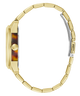 A close-up side view of a wristwatch with a gold-tone metal link bracelet, a round gold-tone case, and a tortoiseshell-patterned dial on a plain white background.