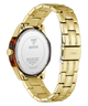 Gold-tone stainless steel watch band with a matching round case, shown from the back on a white background. The back cover is silver-toned with GUESS branding, and the side crown is visible.