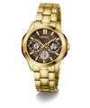 Gold-tone stainless steel wristwatch with a brown dial, featuring three subdials, gold-tone hour markers, and a matching gold-tone link bracelet. The GUESS brand name is visible on the dial.