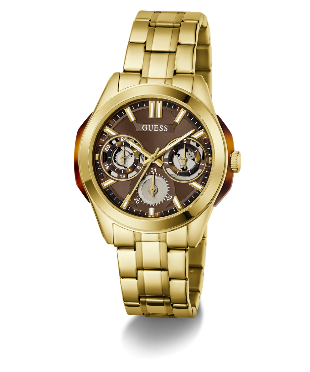 Gold-tone stainless steel wristwatch with a brown dial, featuring three subdials, gold-tone hour markers, and a matching gold-tone link bracelet. The GUESS brand name is visible on the dial.