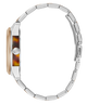 Side profile of a wristwatch with a silver metal link bracelet, a round silver case, and a brown tortoiseshell dial on a plain white background.