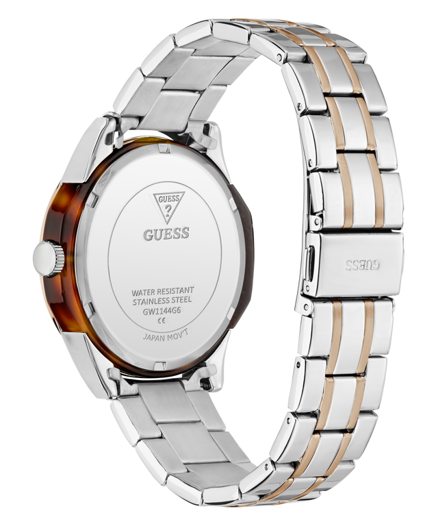 Rear view of a GUESS stainless steel watch with a two-tone silver and gold-tone metal link bracelet and a translucent brown tortoiseshell case back.