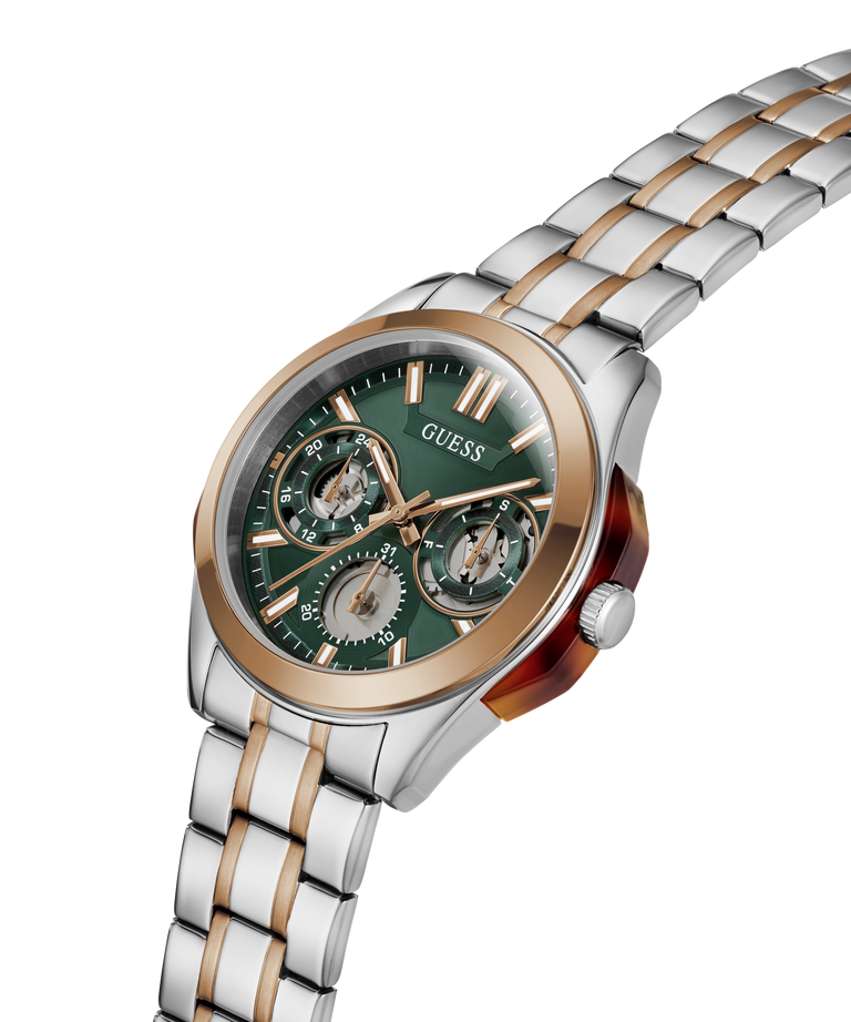 A Guess wrist watch with a two-tone silver and rose gold metal link bracelet, a green dial with three subdials, and a rose gold bezel, shown on a plain white background. lifestyle