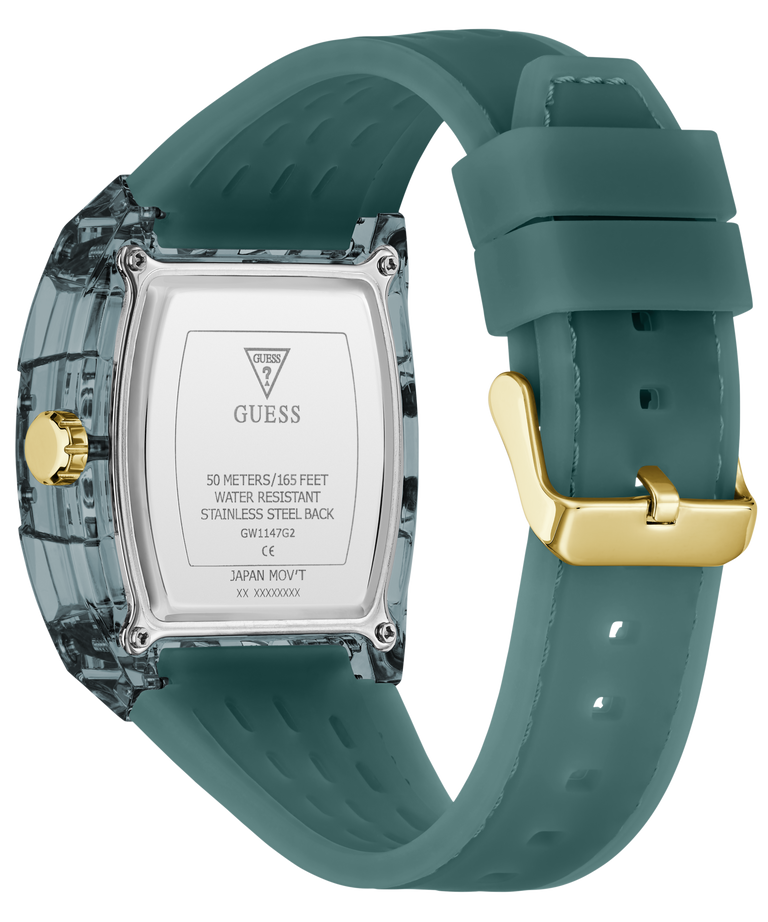 A GUESS watch shown from the back, featuring a translucent smoky gray case, a silver stainless steel back plate with brand text, and a muted teal silicone strap with a gold-tone buckle.