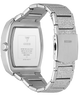 Silver stainless steel watch shown from the back, featuring a rectangular case and a textured metallic link bracelet with the GUESS brand name visible on the clasp and inner case.