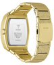 Gold-tone stainless steel watch with a textured gold-tone link band, shown from the back with the case removed to reveal the branded inner plate.