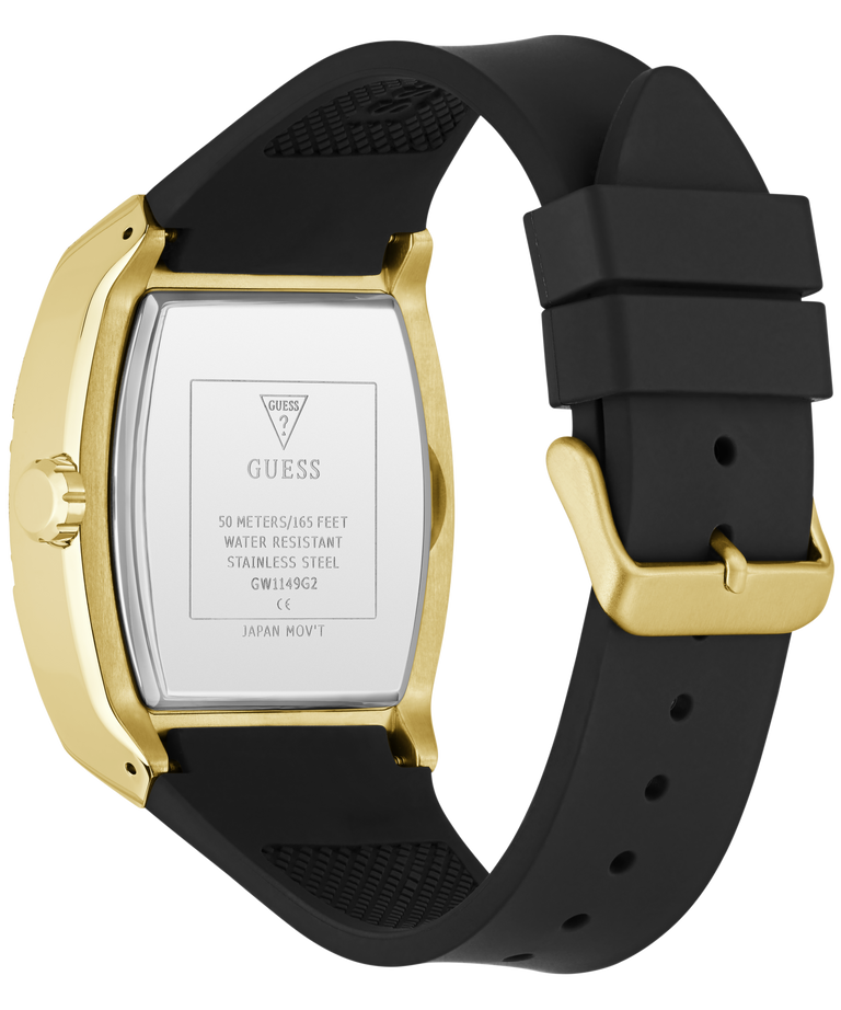 The back view of a GUESS watch with a gold-tone case and a black silicone strap, showing the stainless steel case back with printed specifications.