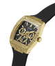 A Guess men's watch featuring a textured gold-tone case, a black dial with gold subdials and markers, and a black rubber strap, shown on a solid white background. lifestyle
