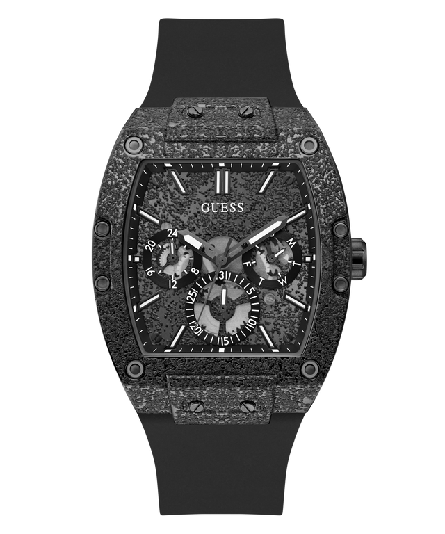 A Guess wristwatch with a textured dark gray and black case, a black dial with three subdials, and a black rubber strap, shown against a plain white background.