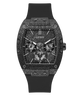 A Guess wristwatch with a textured dark gray and black case, a black dial with three subdials, and a black rubber strap, shown against a plain white background.