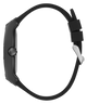 A black watch shown from the side profile, featuring a matte black rectangular case and a matching black silicone strap with a silver-toned metal clasp, isolated on a white background.