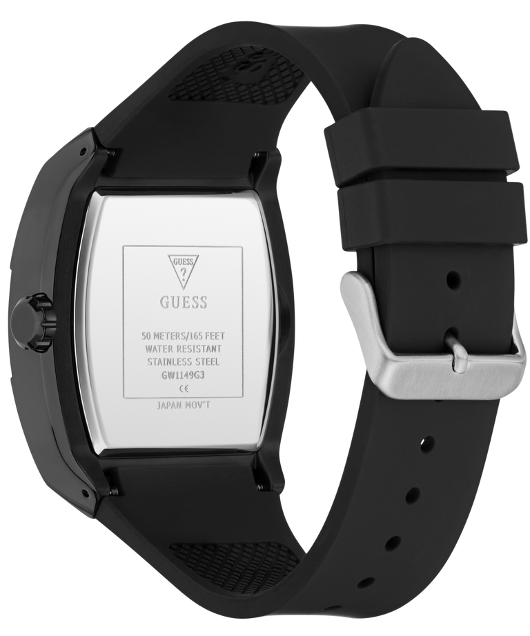 The back of a GUESS watch with a black case and a black silicone strap, featuring a silver-toned buckle and a silver metal case back with printed specifications.