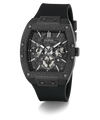 A GUESS chronograph watch with a textured dark gray and black case, a black dial with silver-tone subdials, and a black rubber strap, shown on a white background with a soft shadow.