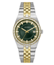 A Guess men's two-tone stainless steel and gold-tone watch with a dark green dial, diamond-accented bezel, and a date window at 3 o'clock, shown on a solid white background.