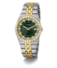 A Guess men's two-tone stainless steel and gold-tone watch with a dark green dial, crystal-embellished bezel, and a date window at 3 o'clock, shown on a clean white background.