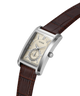 A Guess men's wristwatch with a silver-tone rectangular case, a cream-colored dial with a small sub-dial, and a brown alligator-pattern leather strap, shown on a plain white background. lifestyle