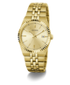 Gold-tone Guess wristwatch with a matching metal link bracelet, gold dial, fluted bezel, and a date window at 3 o'clock, shown on a clean white background.