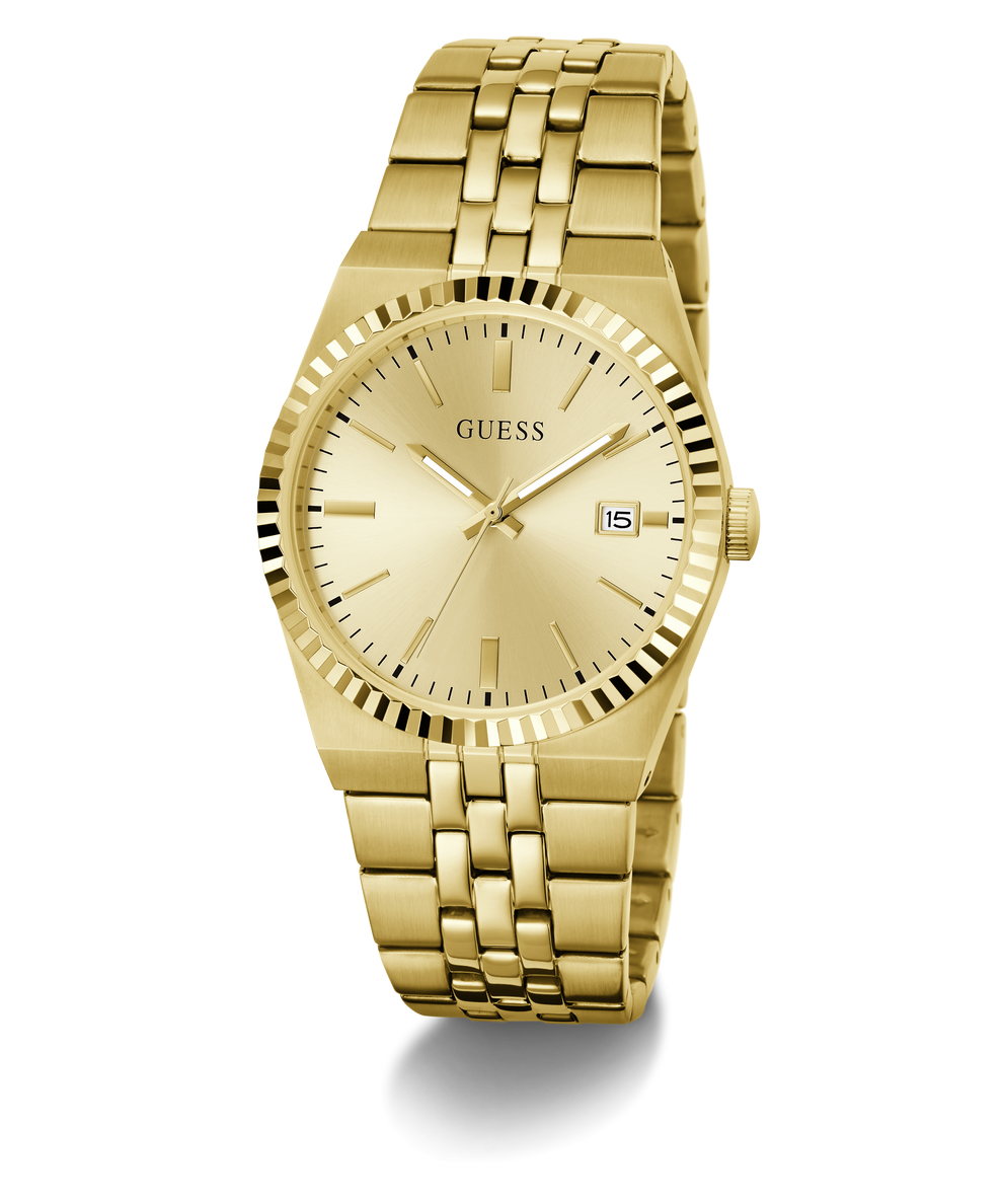 Gold-tone Guess wristwatch with a matching metal link bracelet, gold dial, fluted bezel, and a date window at 3 o'clock, shown on a clean white background.