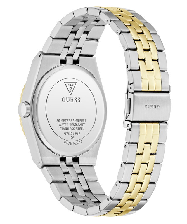 A close-up rear view of a GUESS wristwatch with a two-tone stainless steel and gold link band, showing the branded metal case back and clasp on a white background.