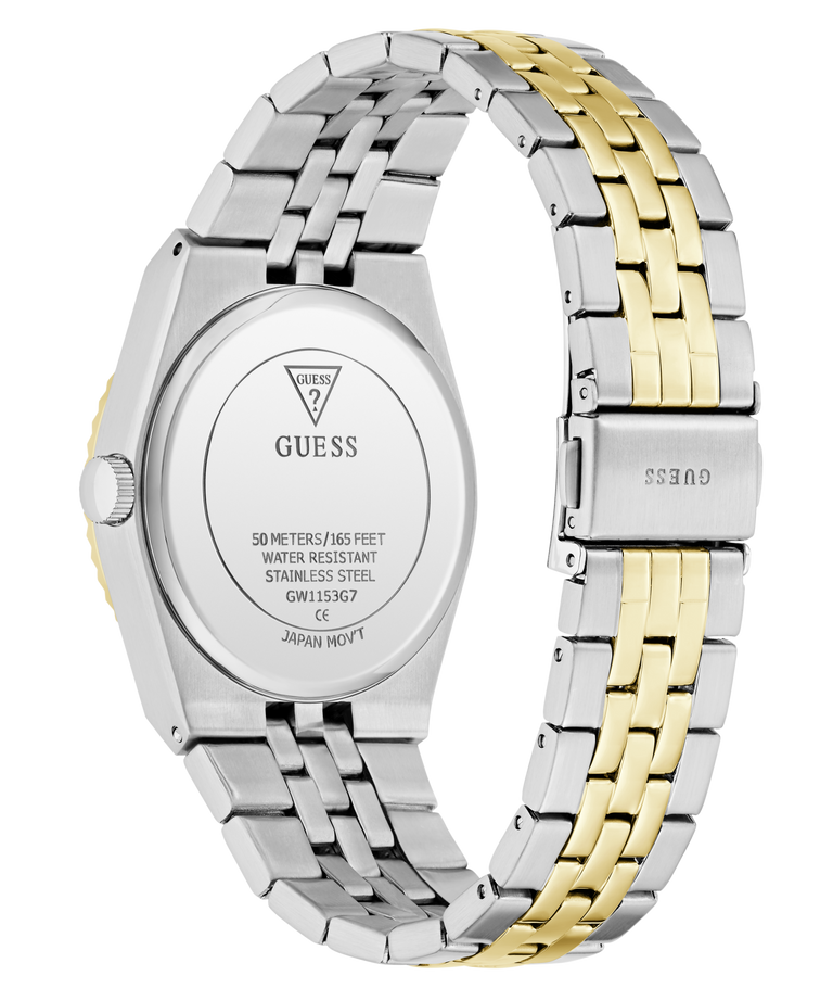 A close-up rear view of a GUESS wristwatch with a two-tone stainless steel and gold link band, showing the branded metal case back and clasp on a white background.