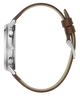 Side profile of a wristwatch with a silver-tone case, brown leather strap, and cream-colored inner lining on a white background.