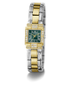 A luxury two-tone watch by GUESS, featuring a gold and silver stainless steel link bracelet, a green dial with gold Roman numerals, and diamond accents on the bezel and crystal.