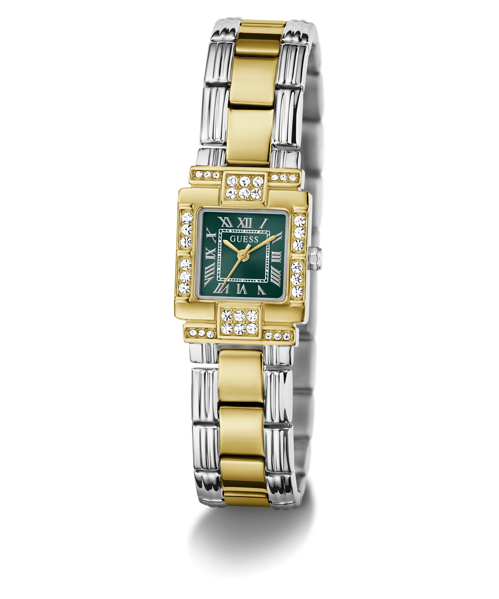 A luxury two-tone watch by GUESS, featuring a gold and silver stainless steel link bracelet, a green dial with gold Roman numerals, and diamond accents on the bezel and crystal.