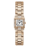 GUESS women's watch featuring a rectangular rose gold case and link bracelet, accented with diamond-like crystals around the bezel and lugs, and a white dial with black Roman numerals.