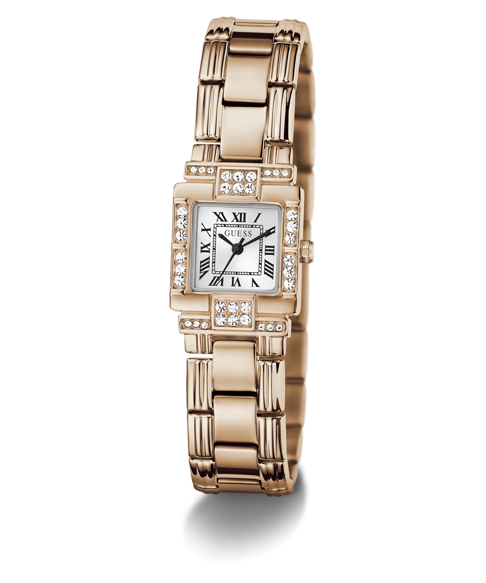 A GUESS watch with a rose gold-tone metal bracelet and case, featuring a white dial with black Roman numerals and diamond accents, shown on a clean white background.