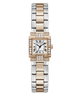 A GUESS women's watch featuring a two-tone rose gold and silver stainless steel link bracelet, a white dial with black Roman numerals, and a bezel accented with pavé-set clear crystals, shown against a plain white background.
