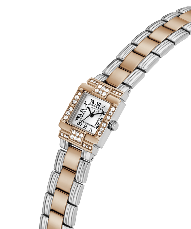 A women's two-tone stainless steel and rose gold watch with a rectangular bezel set with small diamonds, featuring a white dial with black Roman numerals and a matching two-tone link bracelet. lifestyle