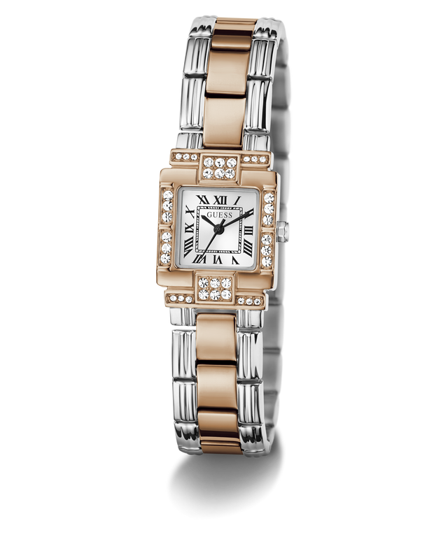 A GUESS watch with a two-tone silver and rose gold bangle bracelet, a silver rectangular dial with black Roman numerals, and a bezel set with clear crystals, shown on a white background.