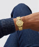 GUESS Archive Chris 95 Gold Tone Analog Watch on wrist