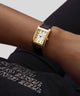 GUESS Archive Alex 90 Black Gold Tone Analog Watch on wrist