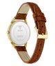The back of a Guess wristwatch with a brown crocodile-embossed leather strap, gold-tone case, and gold buckle, shown on a white background.
