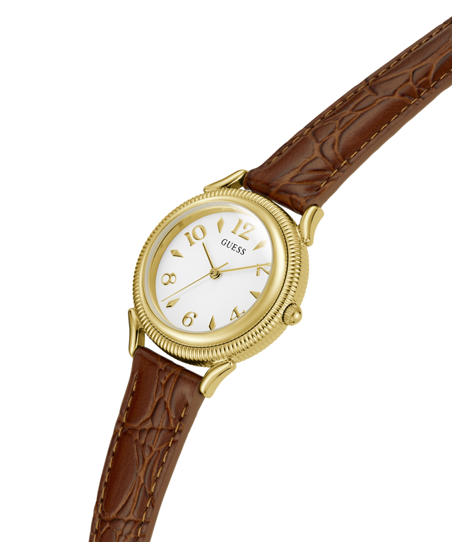 A vintage Guess wristwatch with a gold-tone case, white dial, and brown leather strap, shown diagonally on a plain white background. lifestyle