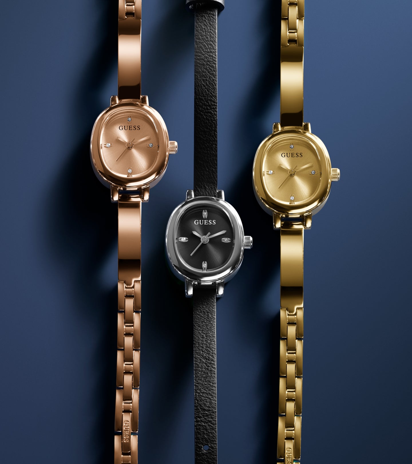 3 womens petite watches on a blue background