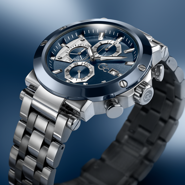 Silver watch with a blue face on a gradient blue background