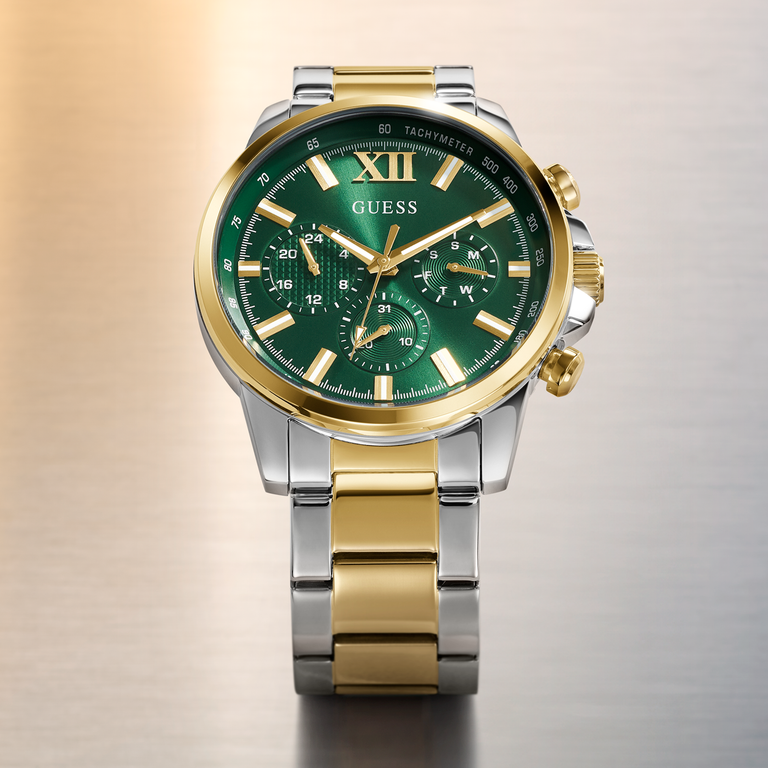 Gold and silver watch with a green dial on a gradient background