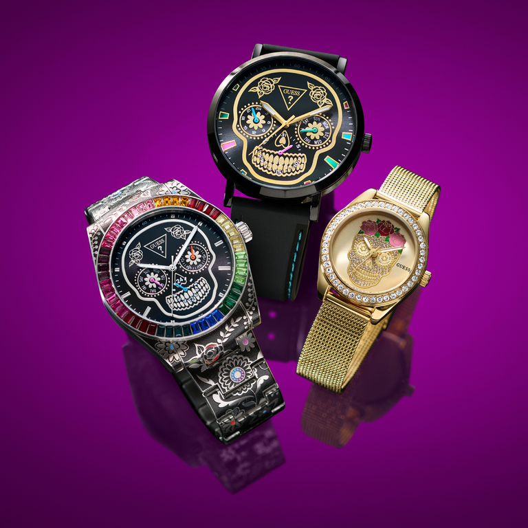 Three unique skull-themed watches on a purple background