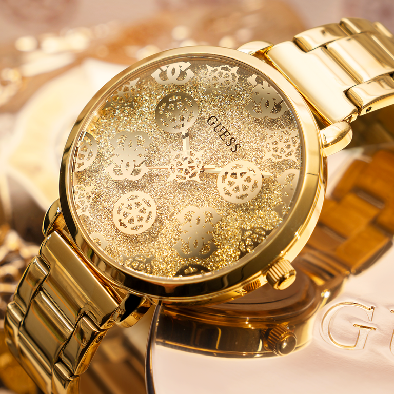 gold womens watch with logo pattern on dial