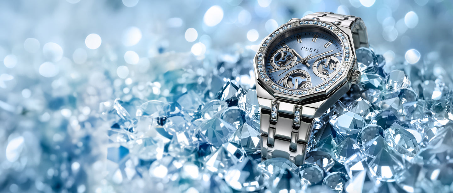GUESS Limited Edition with Swarovski ReCreated™ crystals with gemstones on a blue crystal background