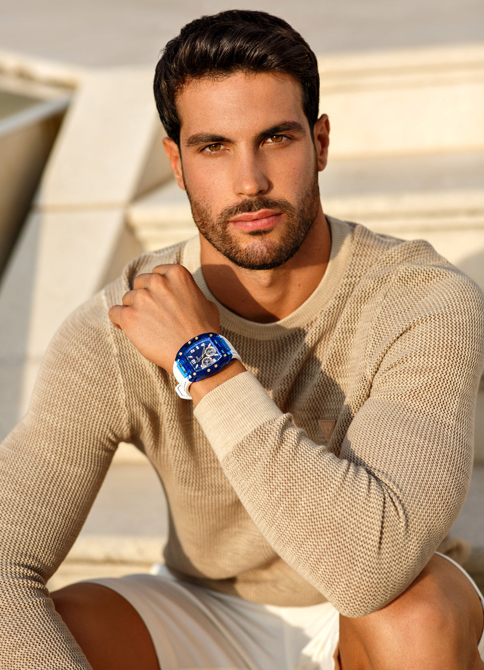 man wearing white and blue watch