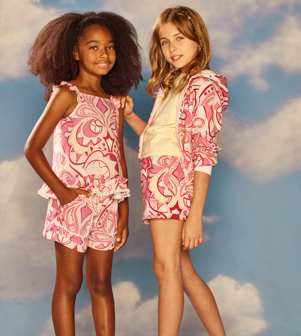 two young girls wearing pink