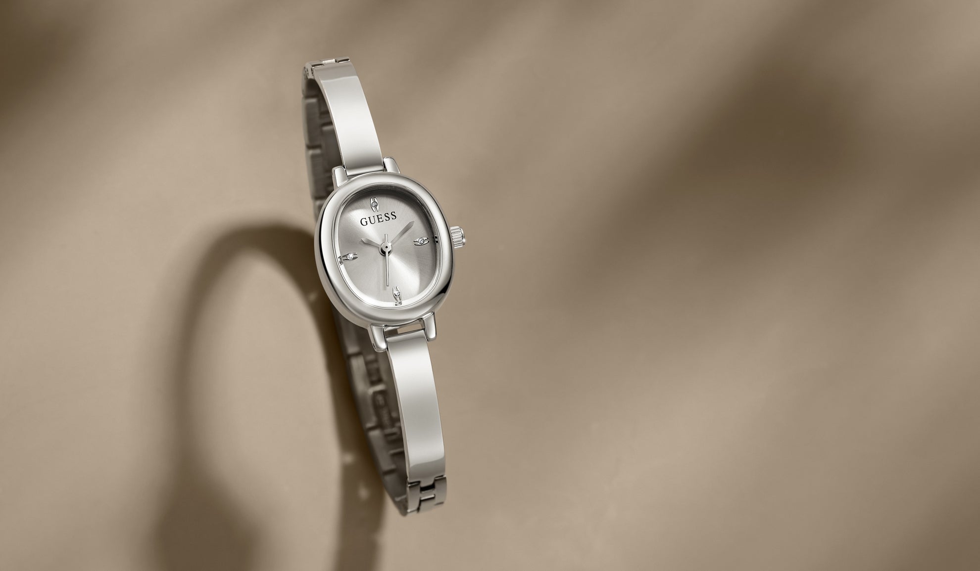 Silver watch on a beige background GW0924L1