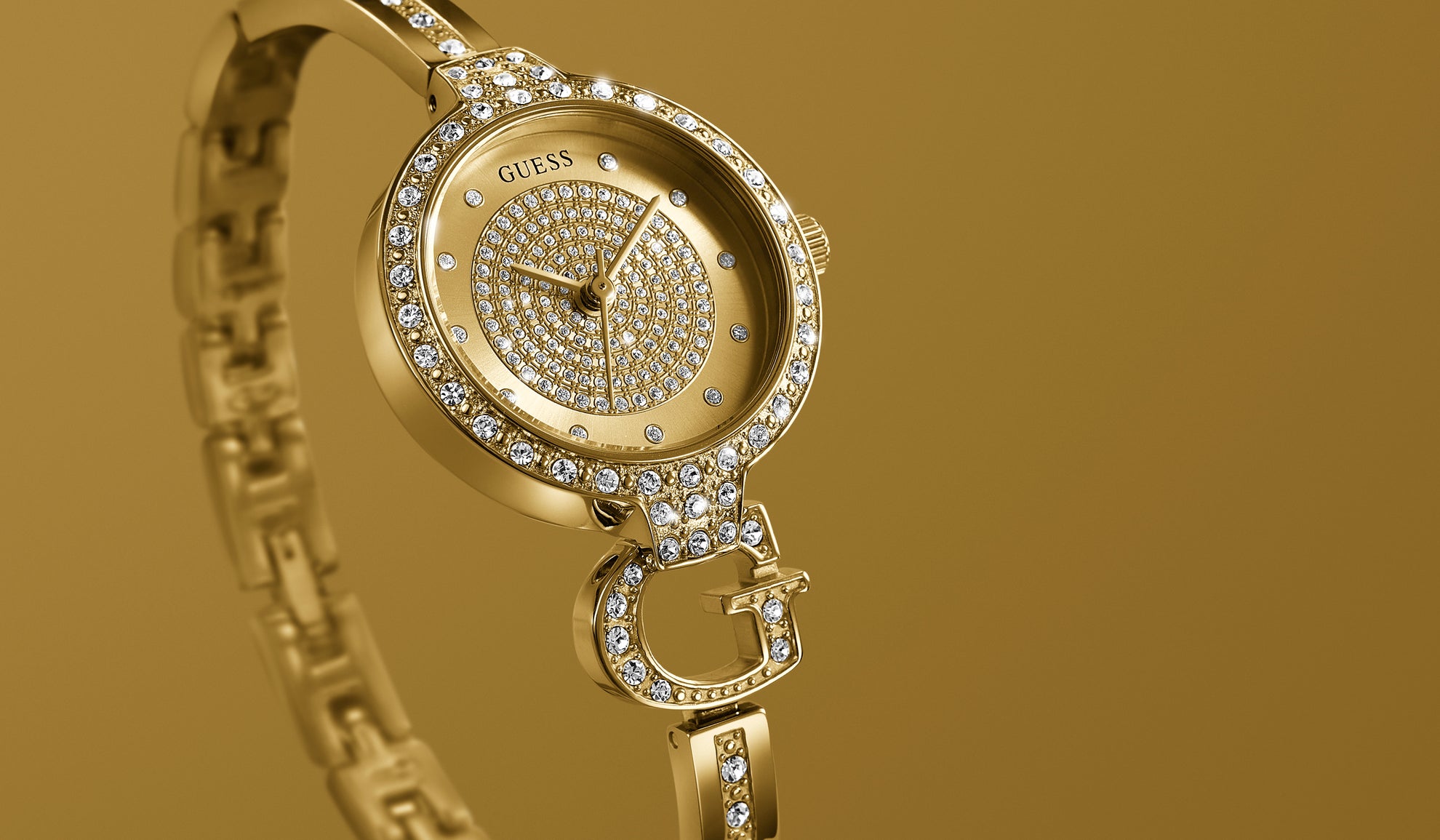 GW0929L2 Gold bangle watch with G logo
